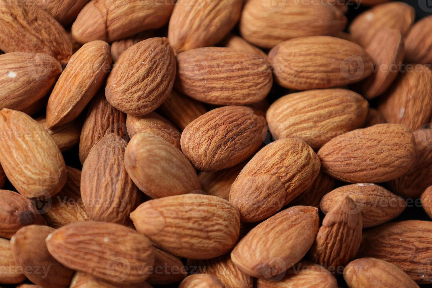 Closeup of almond, nut food, brown almonds photo