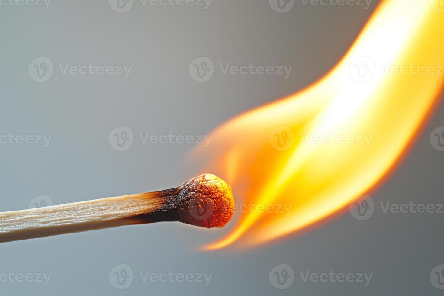 AI generated burning match close-up on a blue background photo