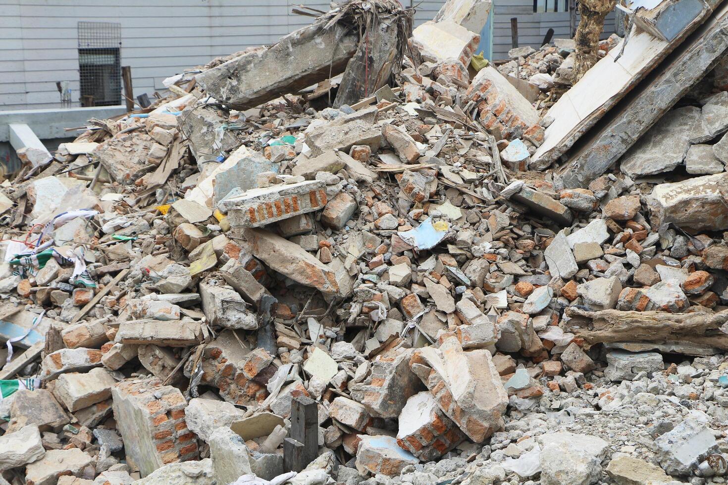 The ruins of the building after the earthquake. House collapsed after a storm. photo