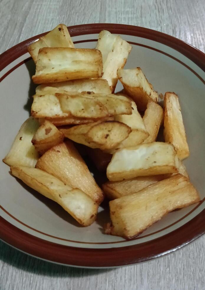 Breakfast menu, fried cassava, and hot sweet tea photo