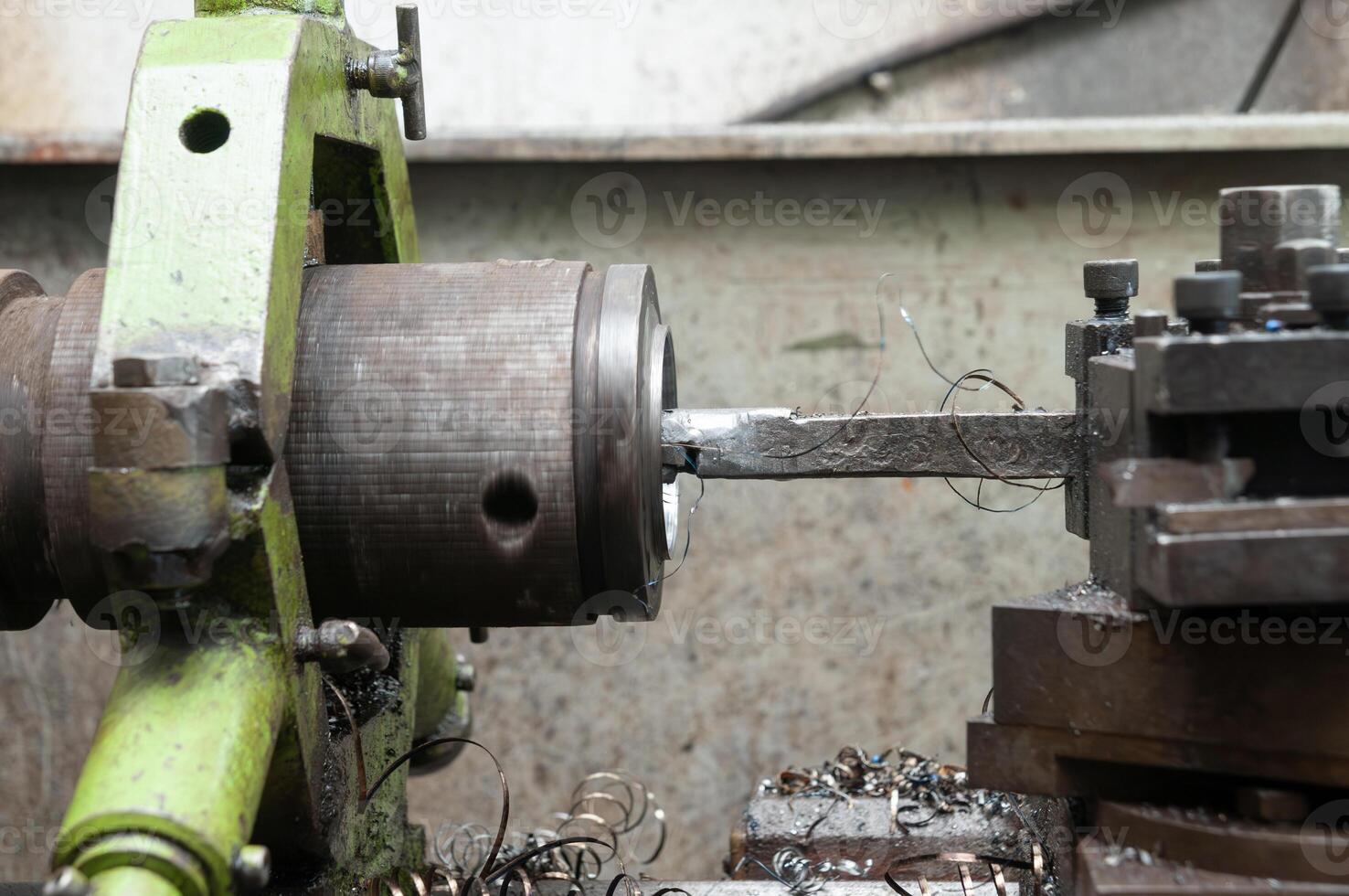 metalworking from a manual bench lathe machine photo