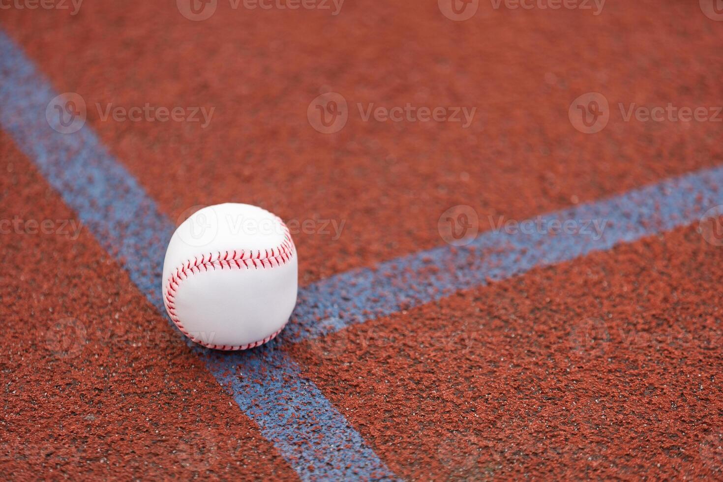 one baseball on infield of sport field photo