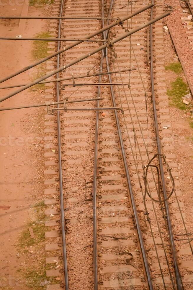 View of train Railway Tracks from the middle during daytime at Kathgodam railway station in India, Train railway track view, Indian Railway junction, Heavy industry photo