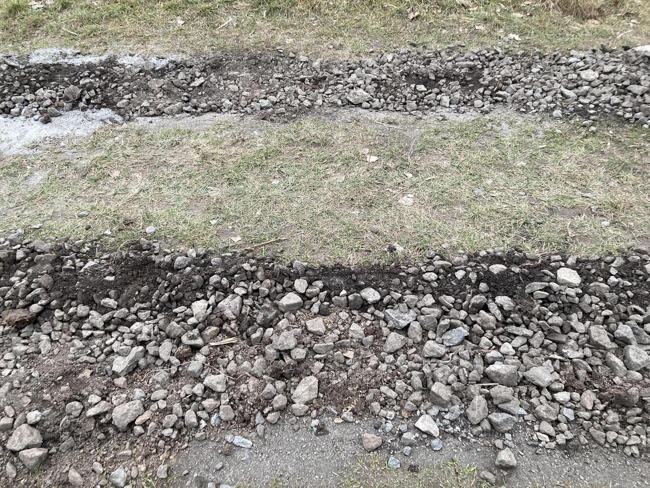 Construction of road filling with gravel photo
