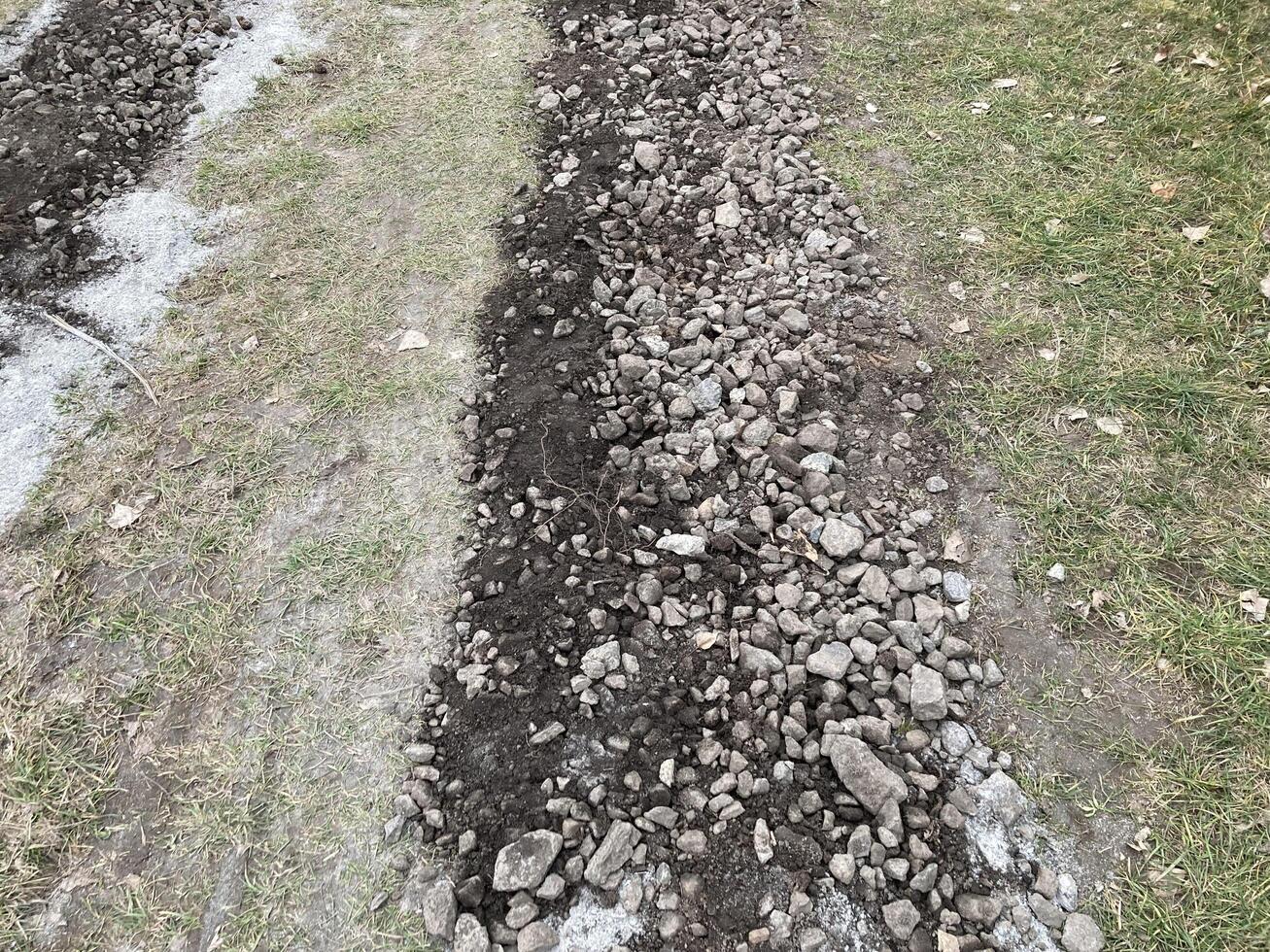 Construction of road filling with gravel photo