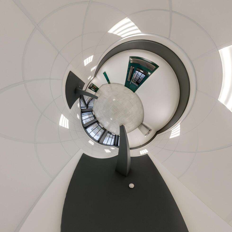 abstractly twisted into a spherical 360 panorama interior of a modern office with a hall staircase and panoramic windows photo