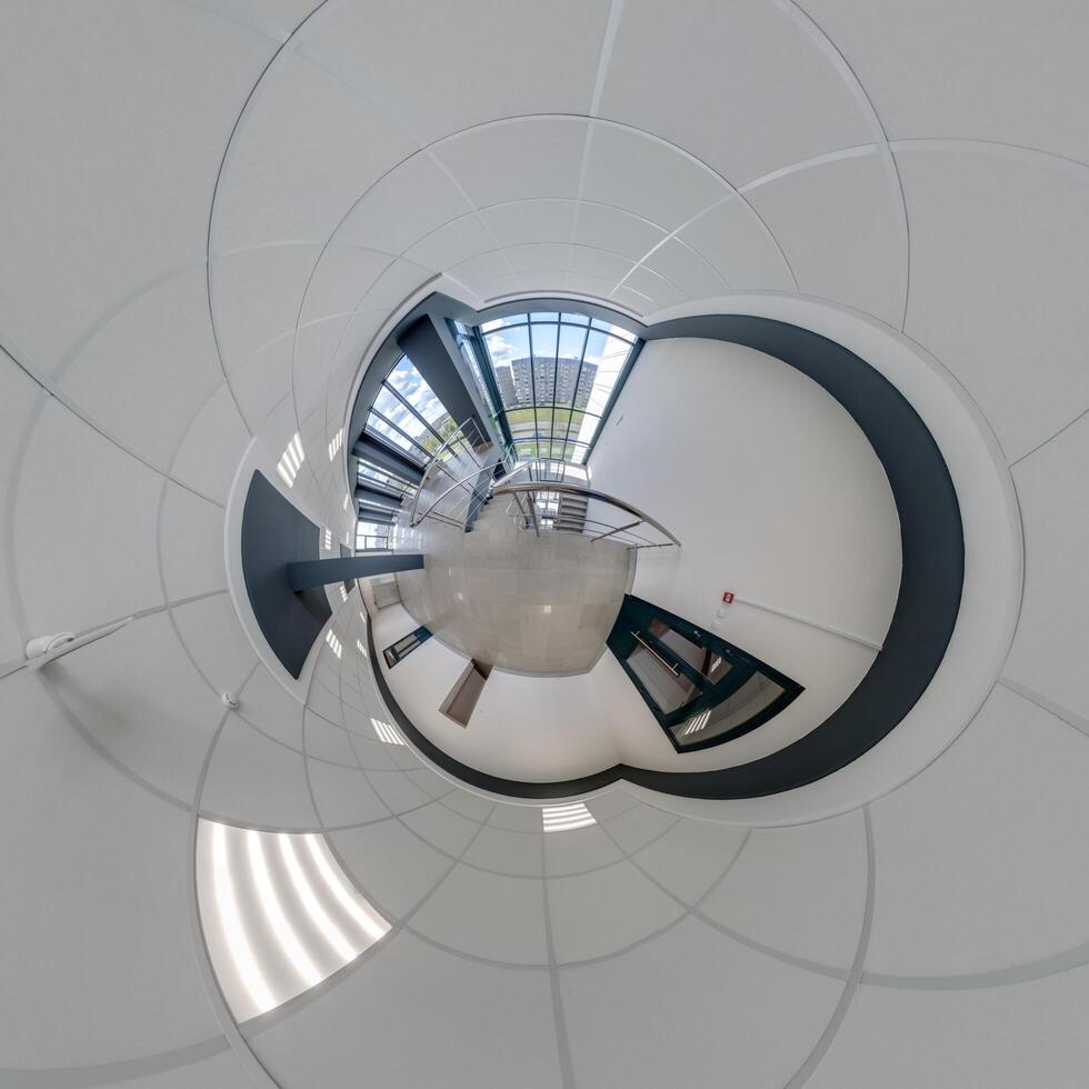 abstractly twisted into a spherical 360 panorama interior of a modern office with a hall staircase and panoramic windows photo