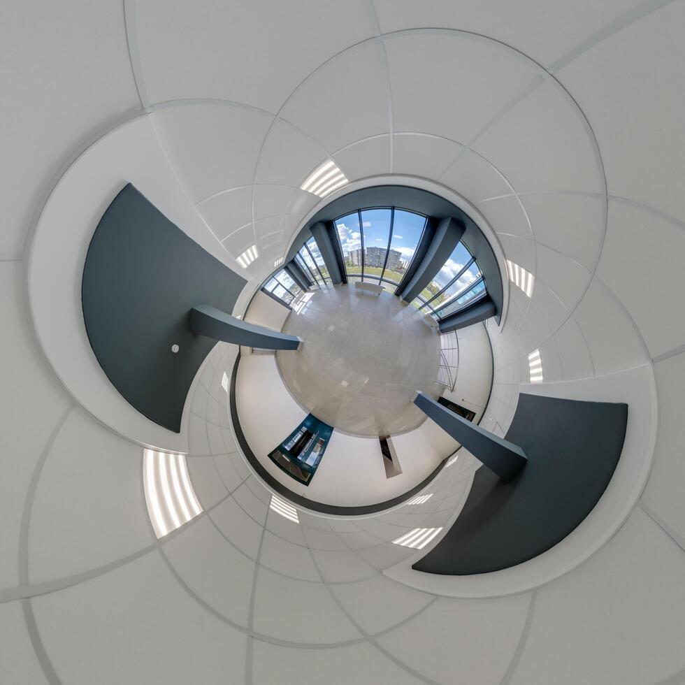 abstractly twisted into a spherical 360 panorama interior of a modern office with a hall staircase and panoramic windows photo