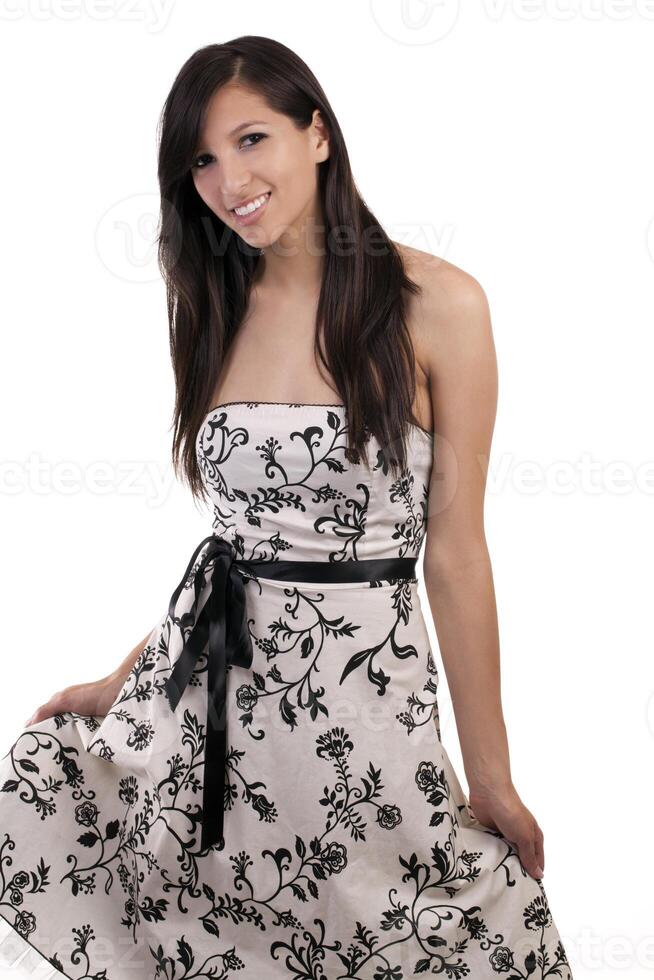 Young smiling caucasian woman standing in dress photo