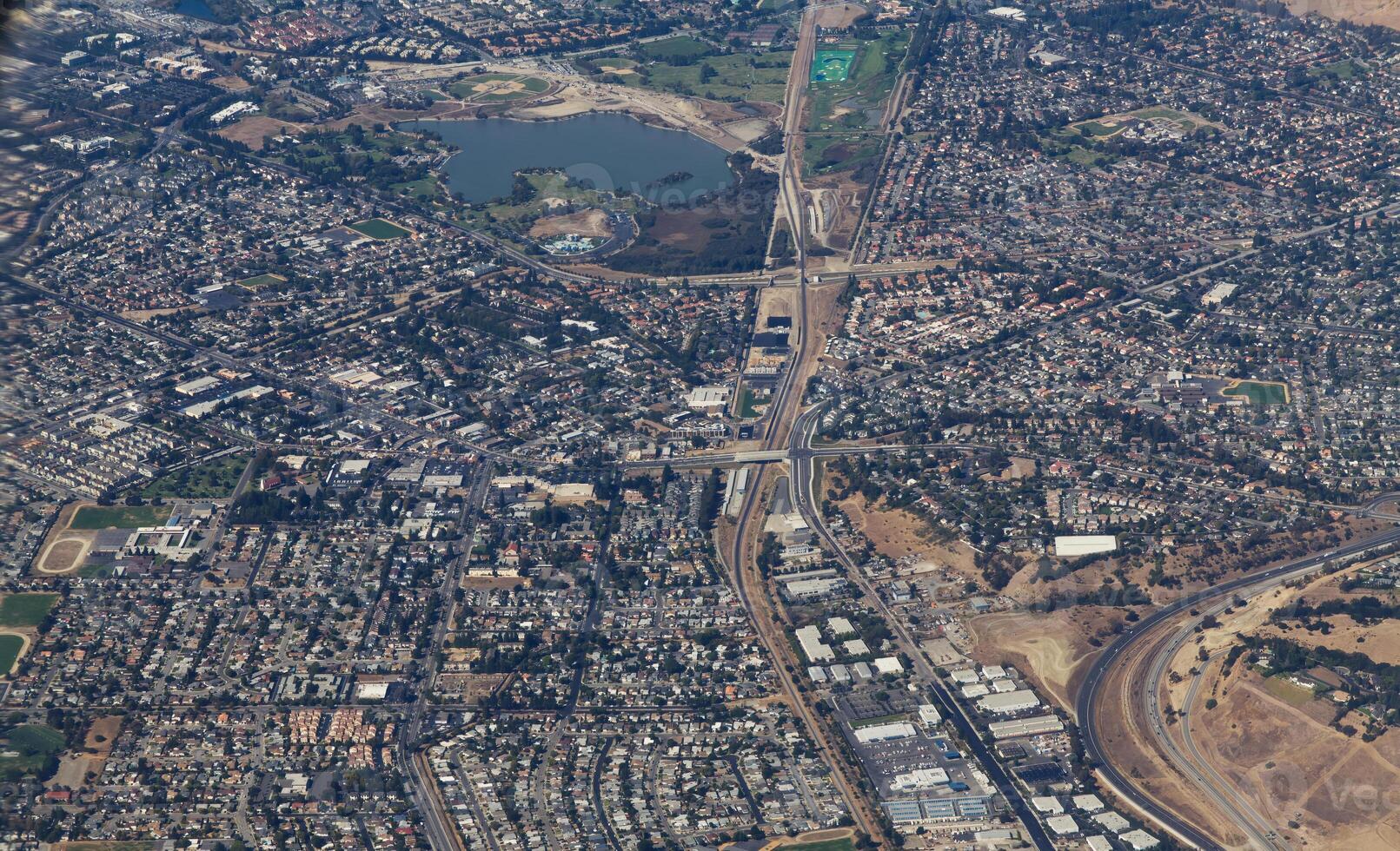 Aerial View Of Suburbs California With Lake Buildings Roads photo