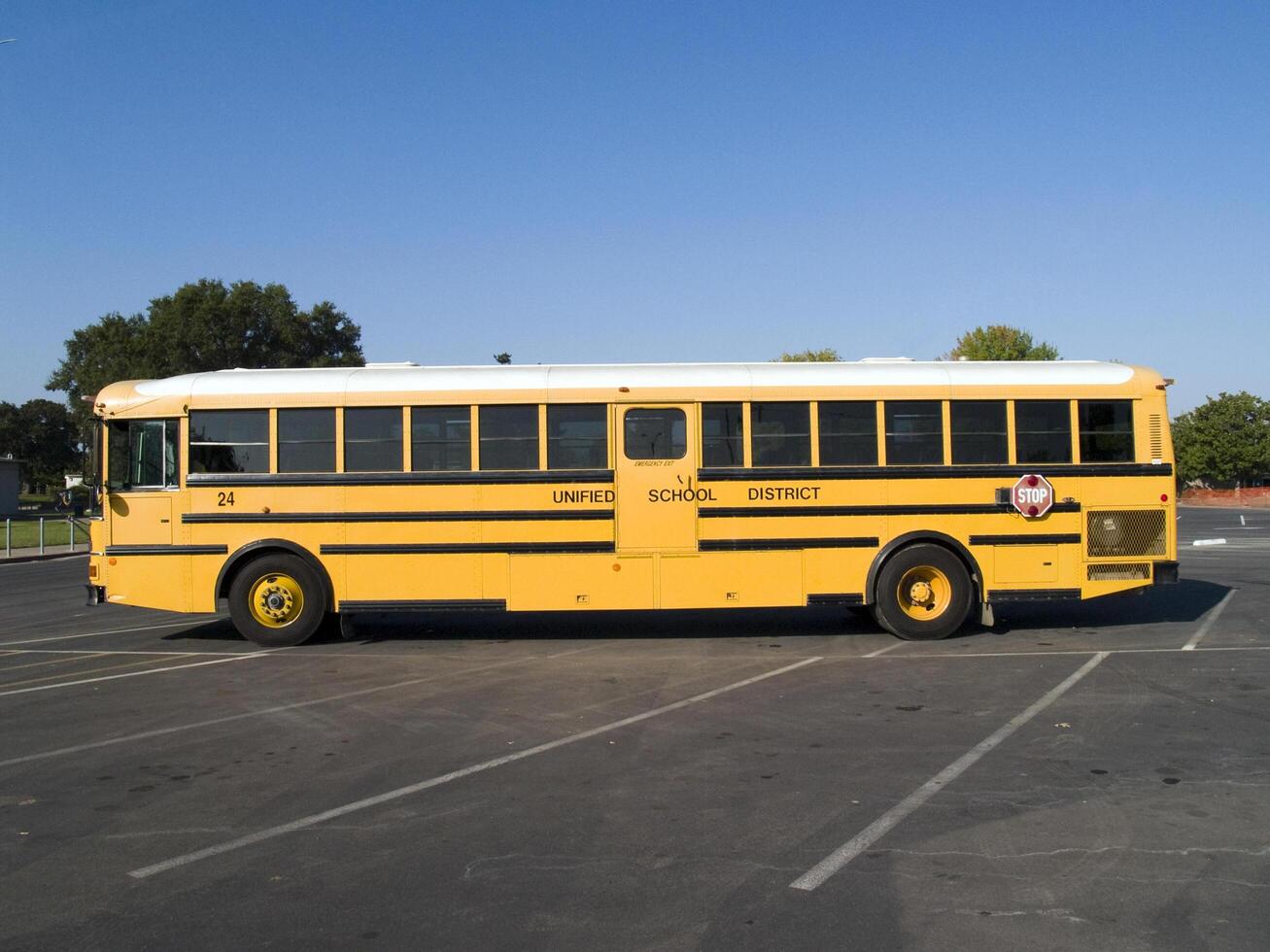 Sacramento, CA, 2006 - Yellow school bus in school parking lot photo