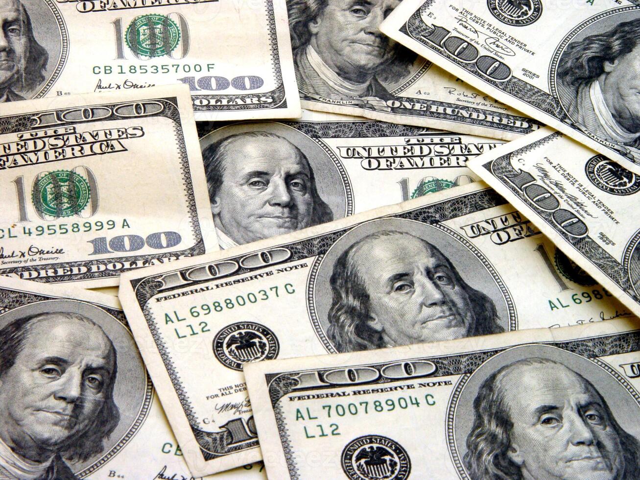 100 Dollar Bills spread out in random display photo