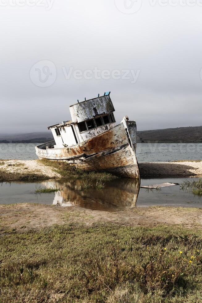 Abandoned Fishing Boat Aground On Shore Point Reyes California photo