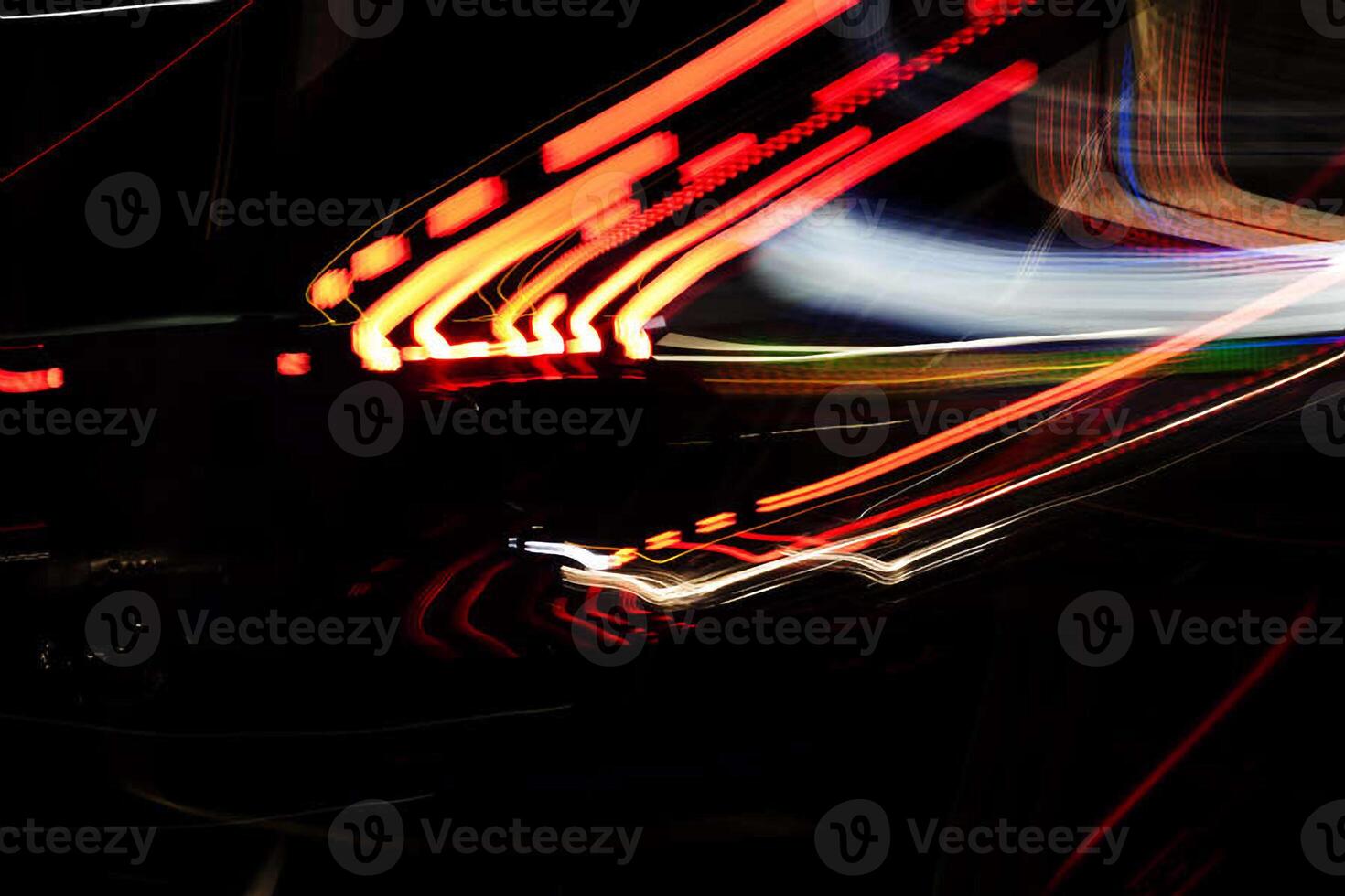 Abstract Pattern Of Neon Lights Streaked On Dark Background photo