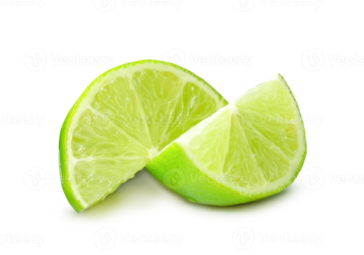 Front view of fresh green lemon fruit in slices or quarters isolated on white background with clipping path photo