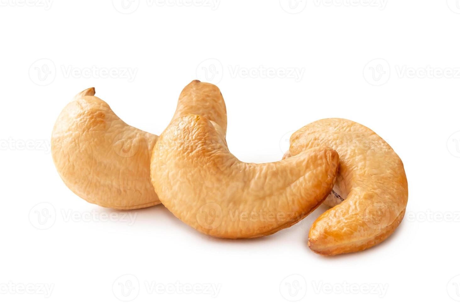 Front view of three Roasted brown cashew nuts in stack isolated on white background with clipping path photo