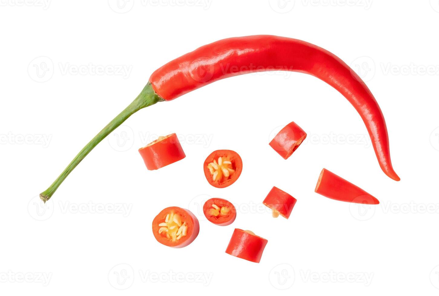 Top view and flat lay of single fresh curved red chili pepper with slices isolated on white background with clipping path photo