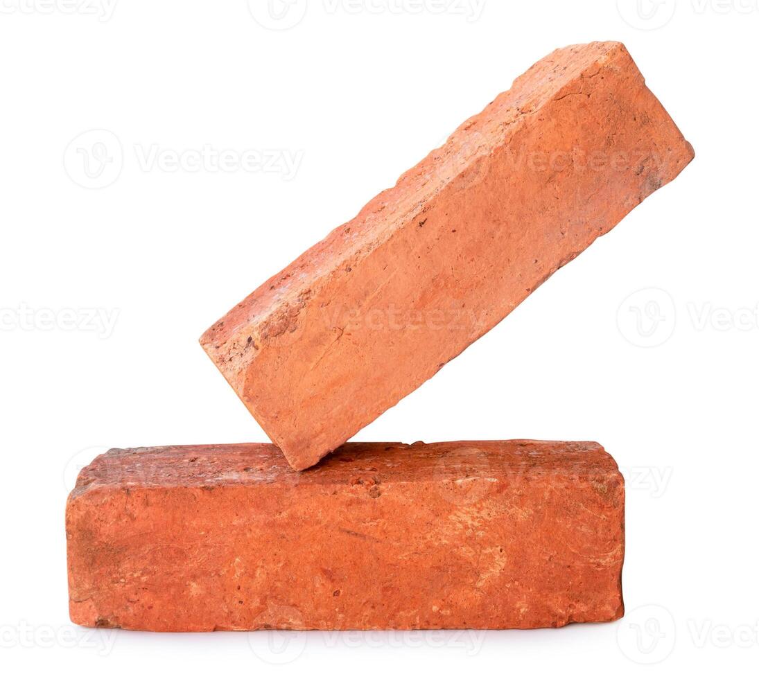 Side view of old red or orange bricks in stack isolated on white background with clipping path photo