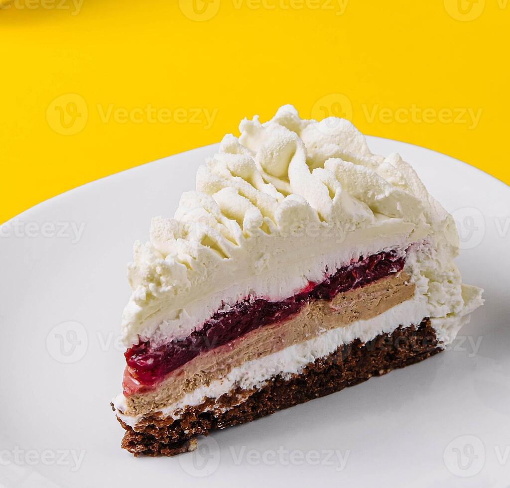 Layered Mousse Cake close up on yellow background photo