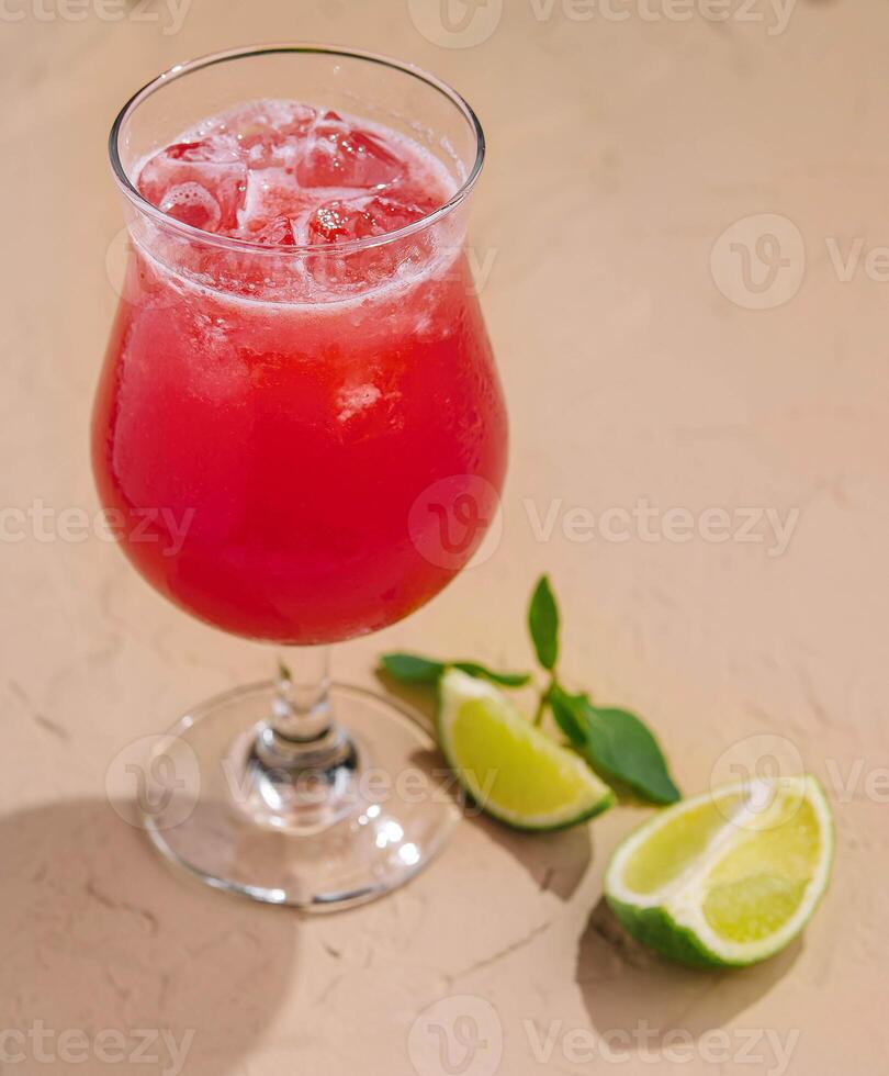 Cold summer strawberry cocktail with lime photo