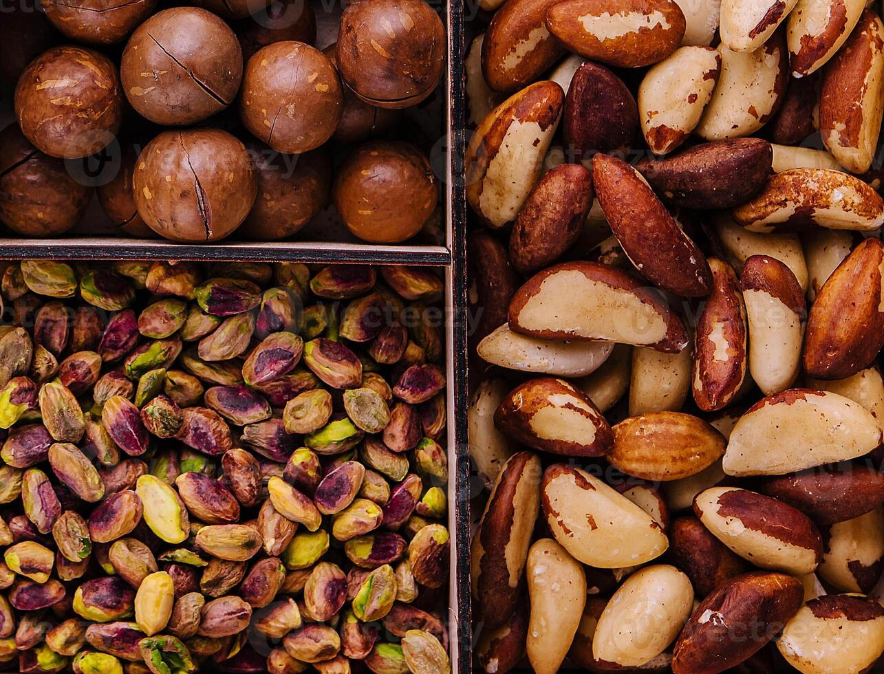 Assorted nuts in a wooden box closeup photo