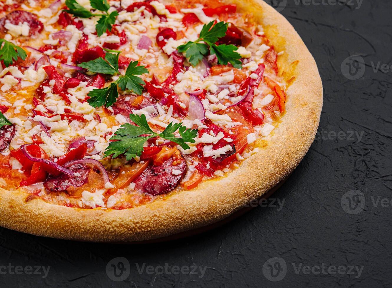 Italian pizza on black stone photo