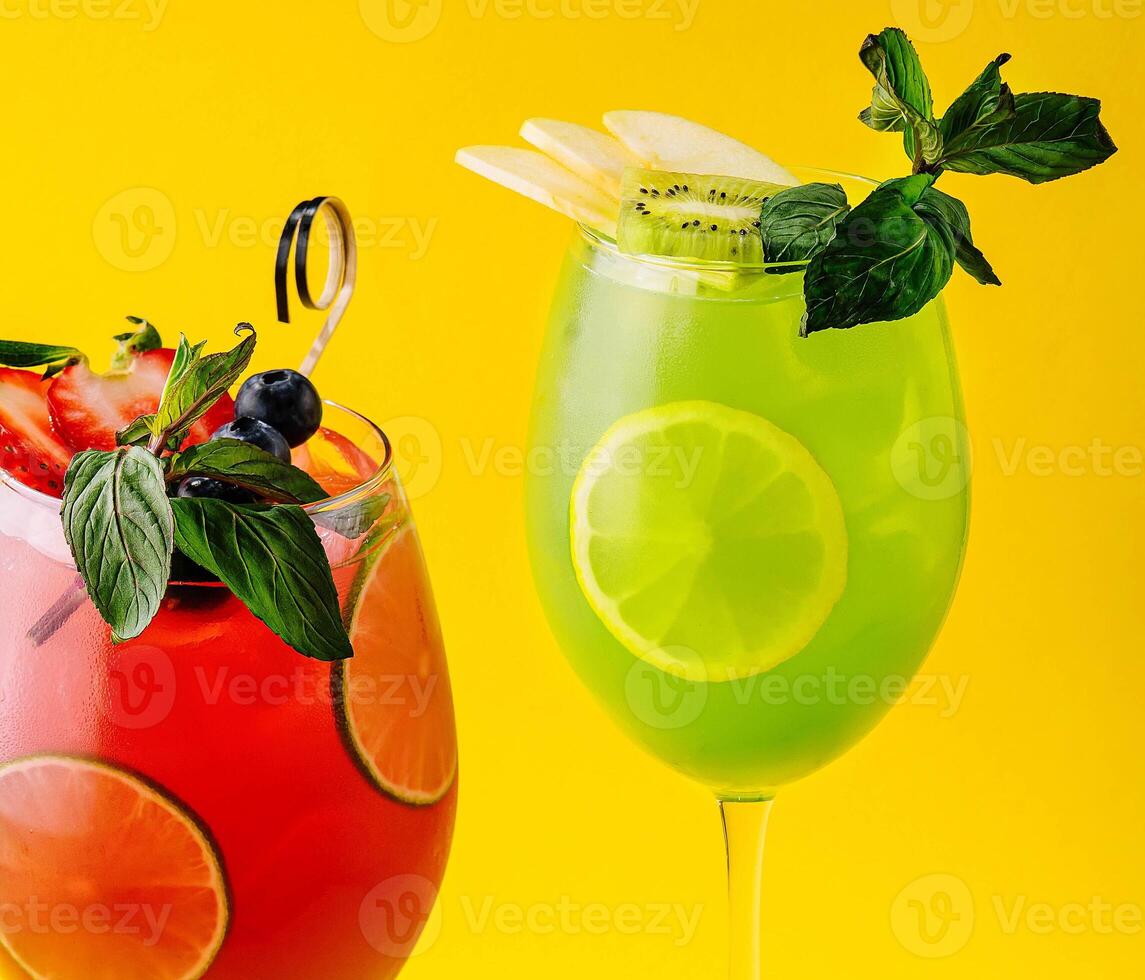 Cocktails with fresh strawberries, kiwi and lemons photo