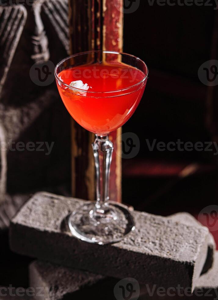 Italian cocktail with flower on gray stone photo