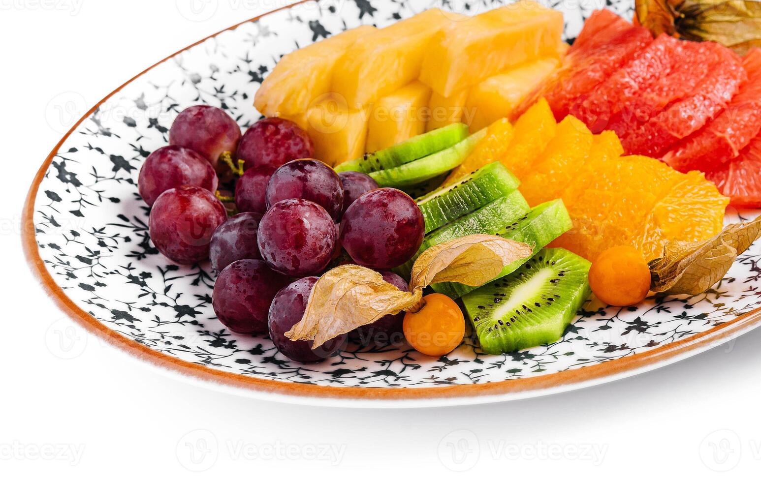 different tropical fruits on a plate photo