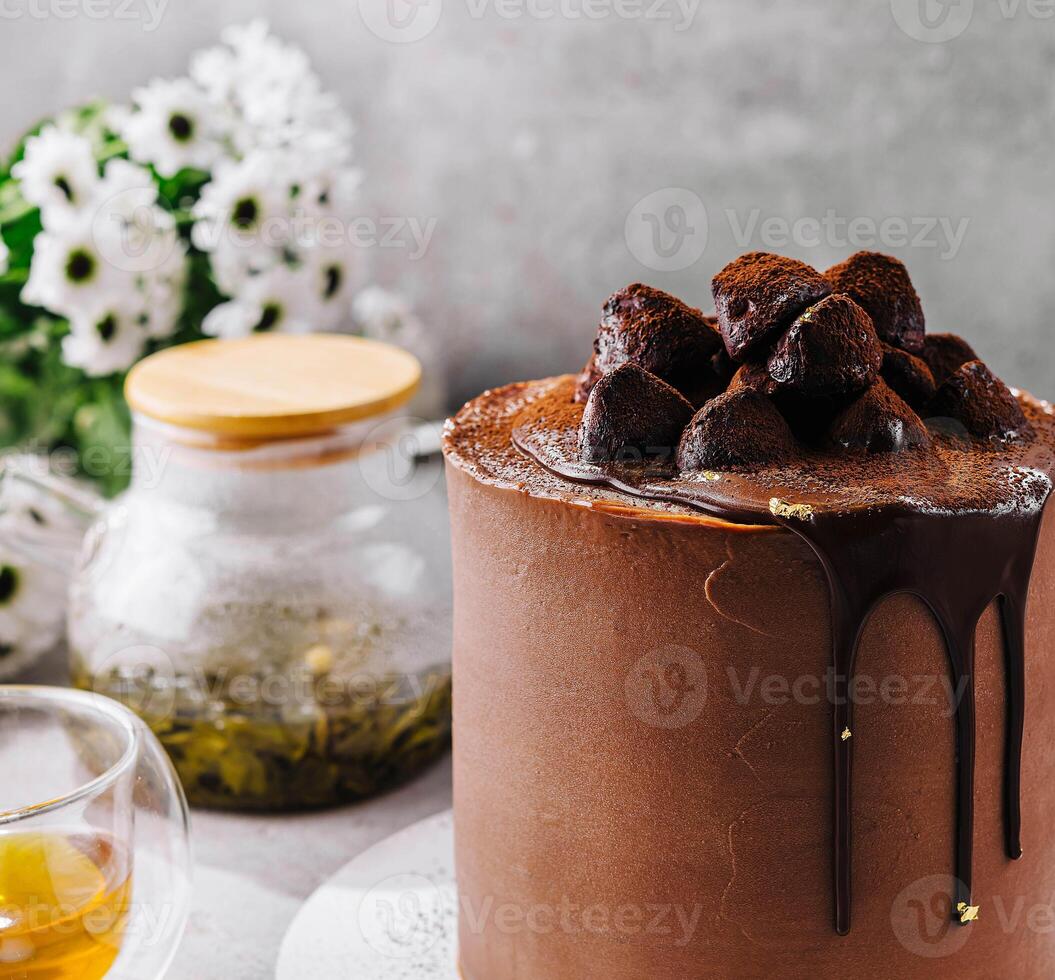 chocolate cake with truffles and tea photo