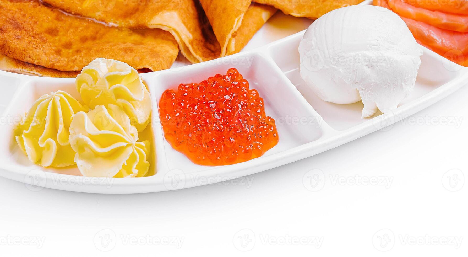 pancakes with red caviar and salmon and ice cream photo