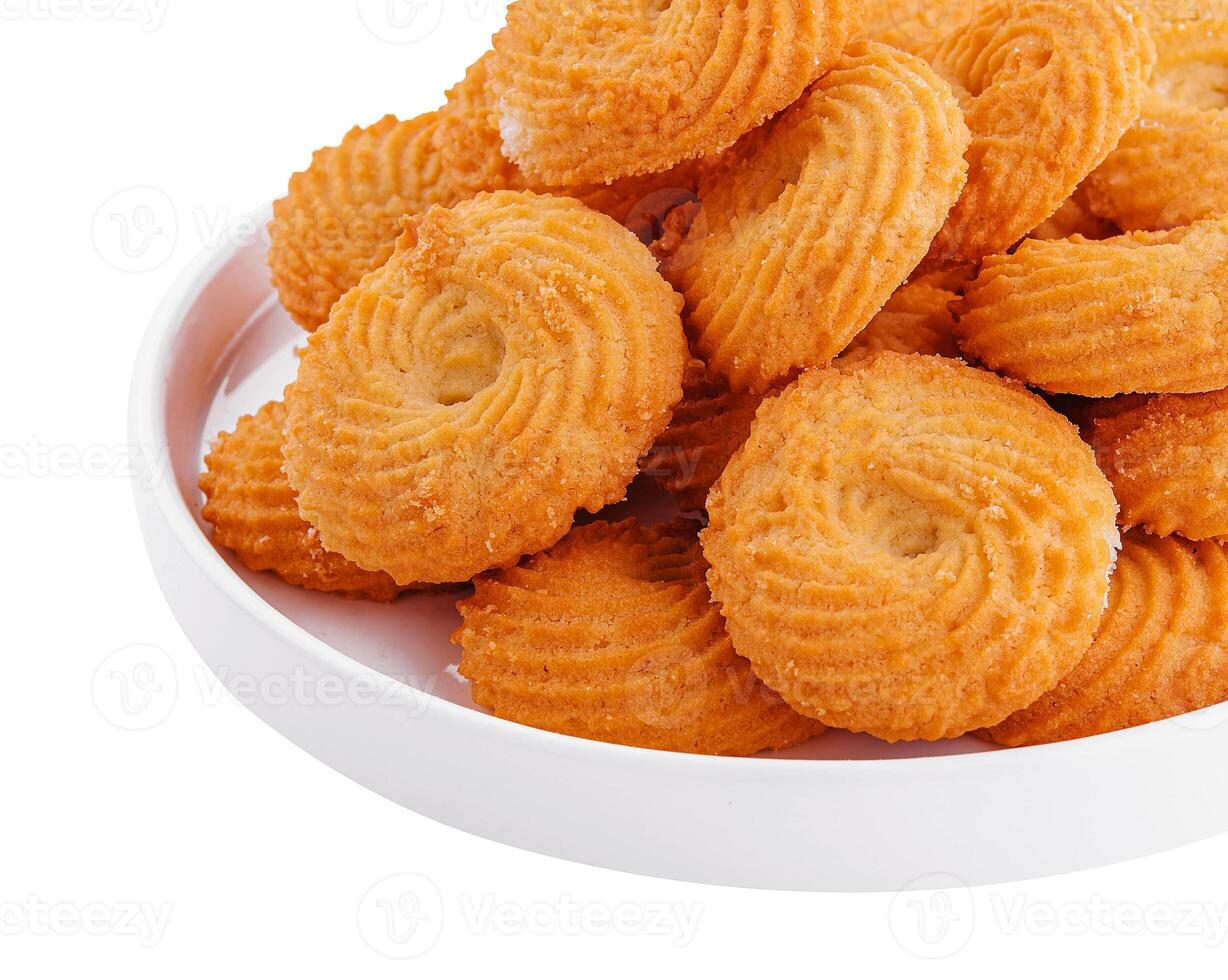 Homemade crunchy cookies on white plate photo