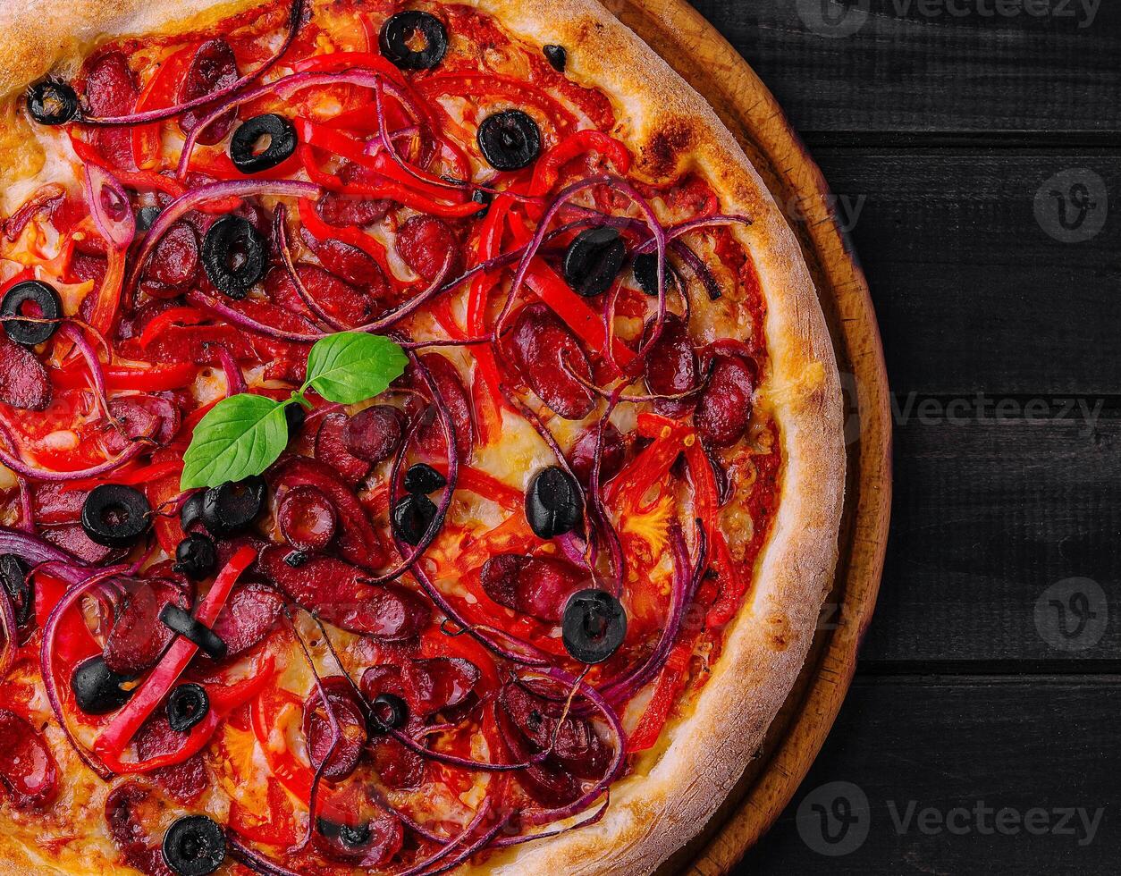 Pizza with Bavarian sausages with bell pepper and red onion photo