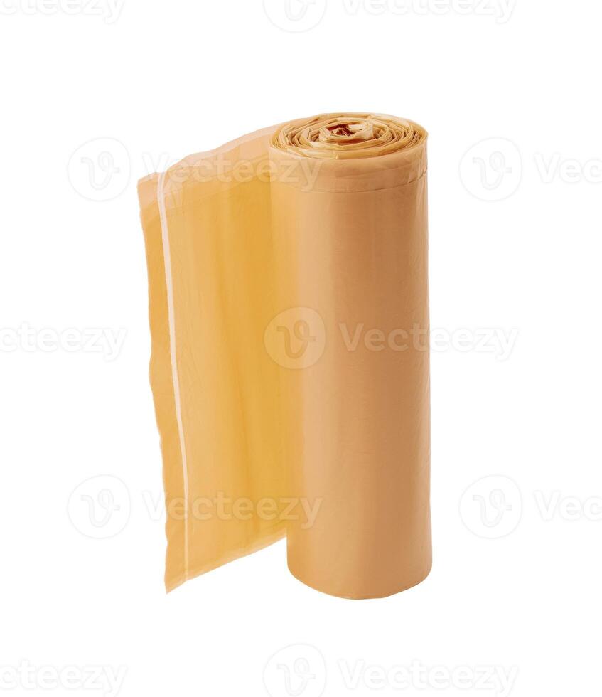 Yellow roll of garbage bags isolated on white background photo