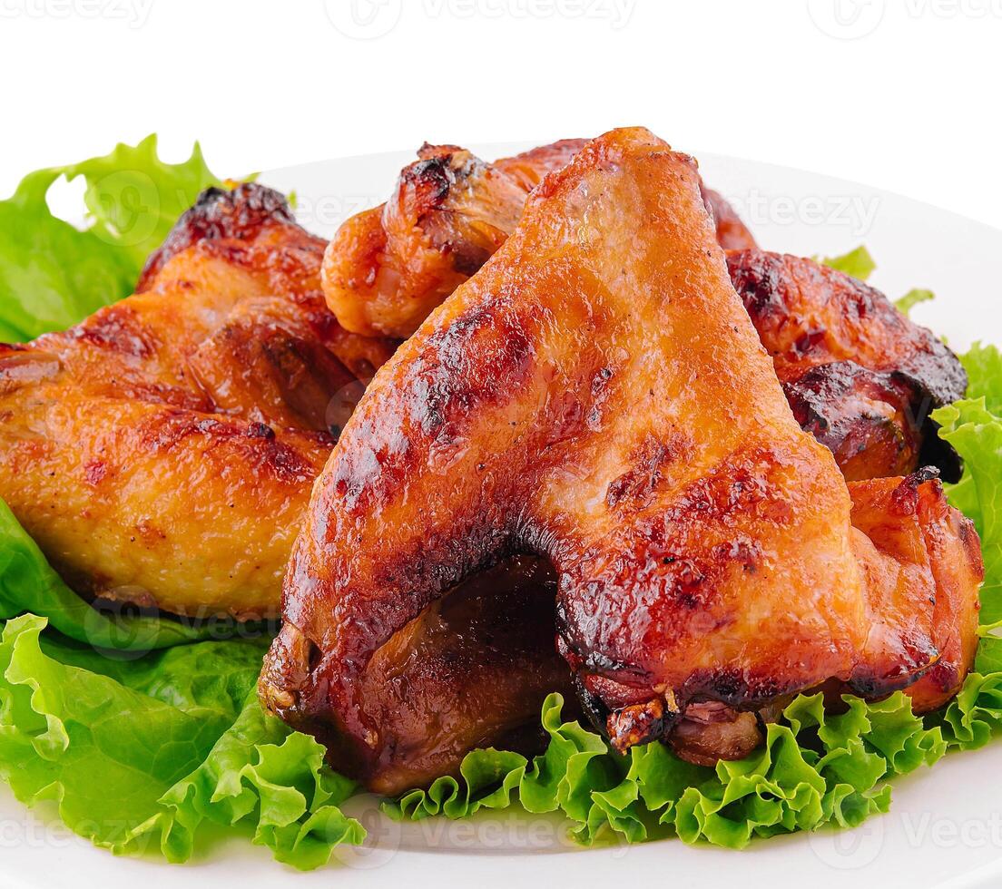 fried chicken wings on white plate photo