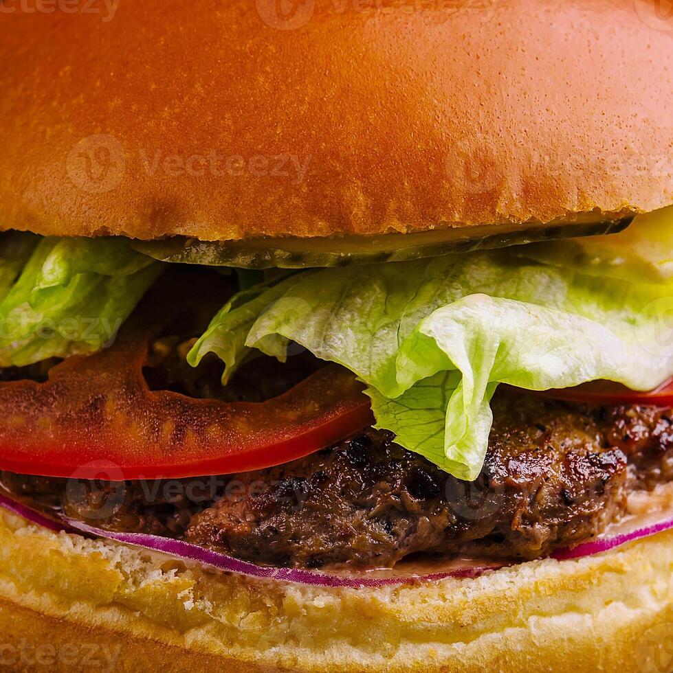 Burger with beef cutlet and fresh vegetables photo