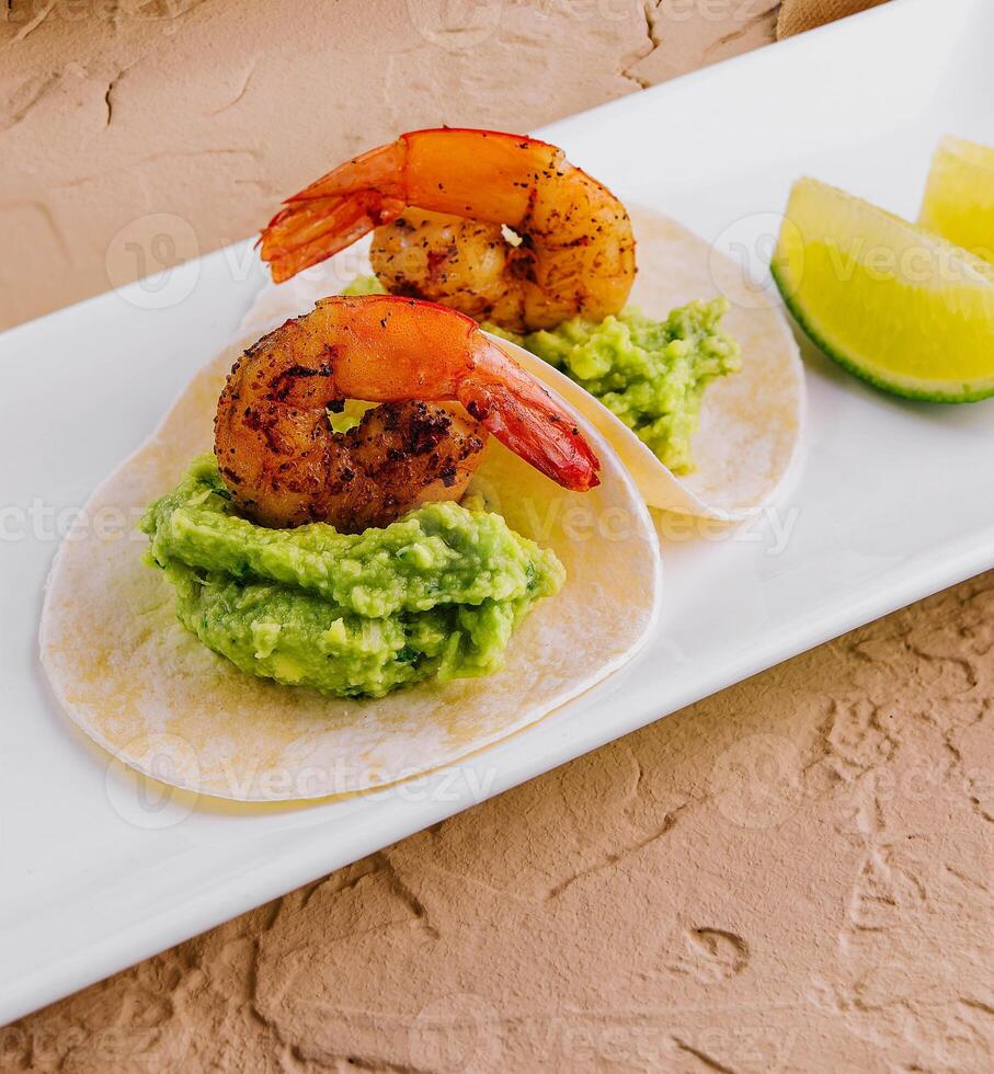 pita with avocado puree and shrimp photo