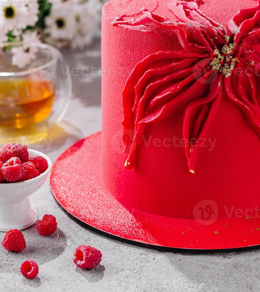 Contemporary raspberry mousse cake and tea photo