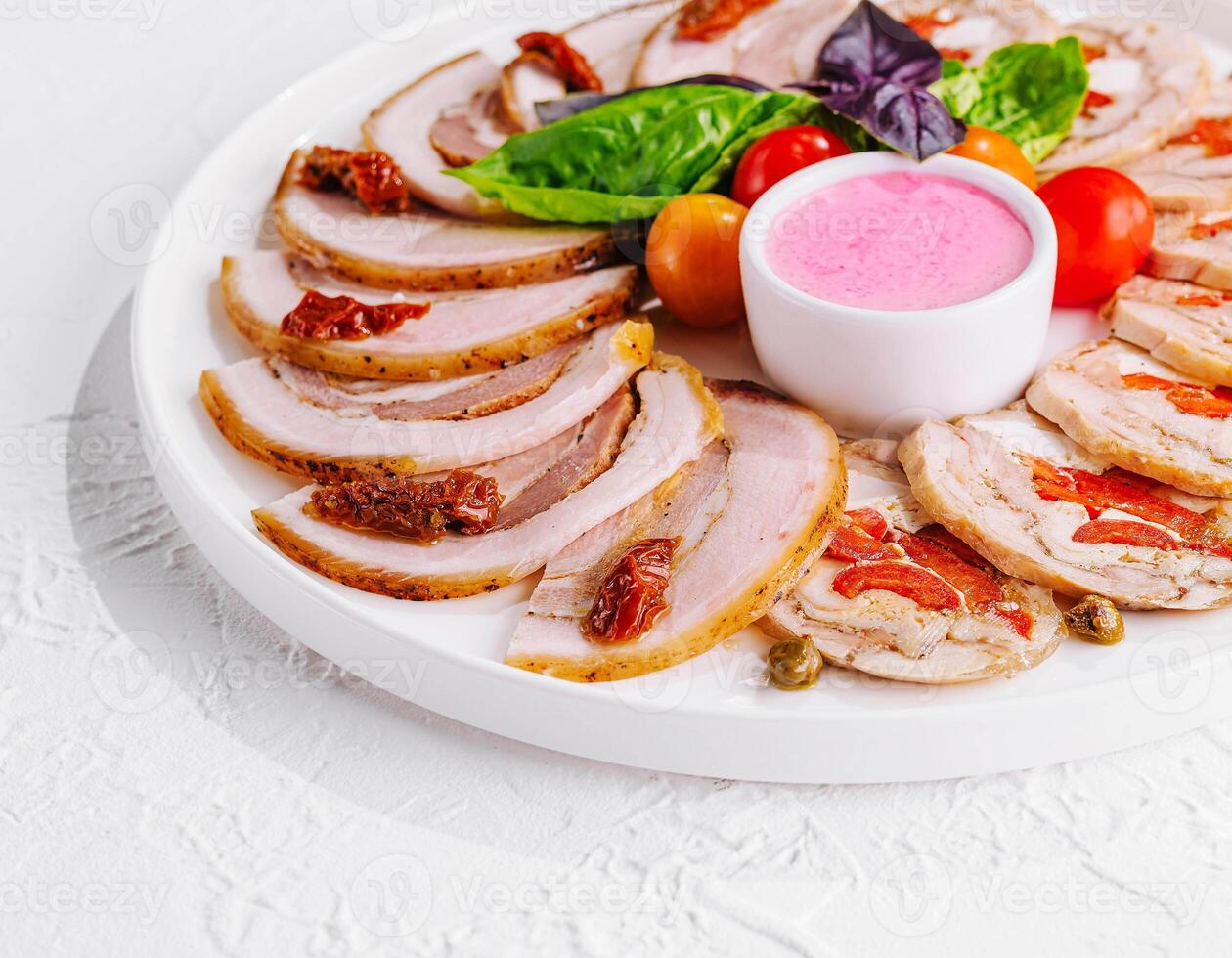 sliced meatloaf with peppers and capers photo