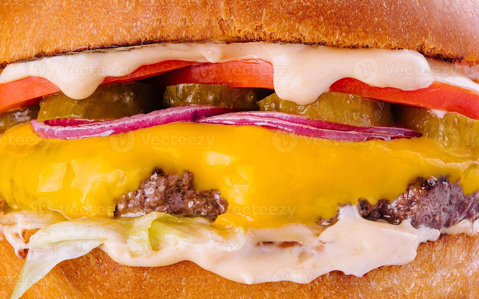 Tasty and appetizing hamburger cheeseburger macro photo