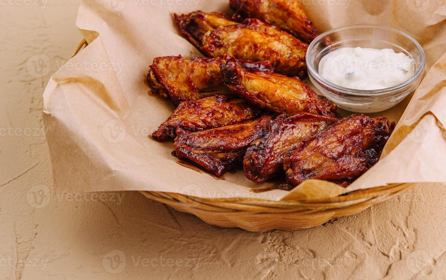 Barbecue chicken wings in the basket photo