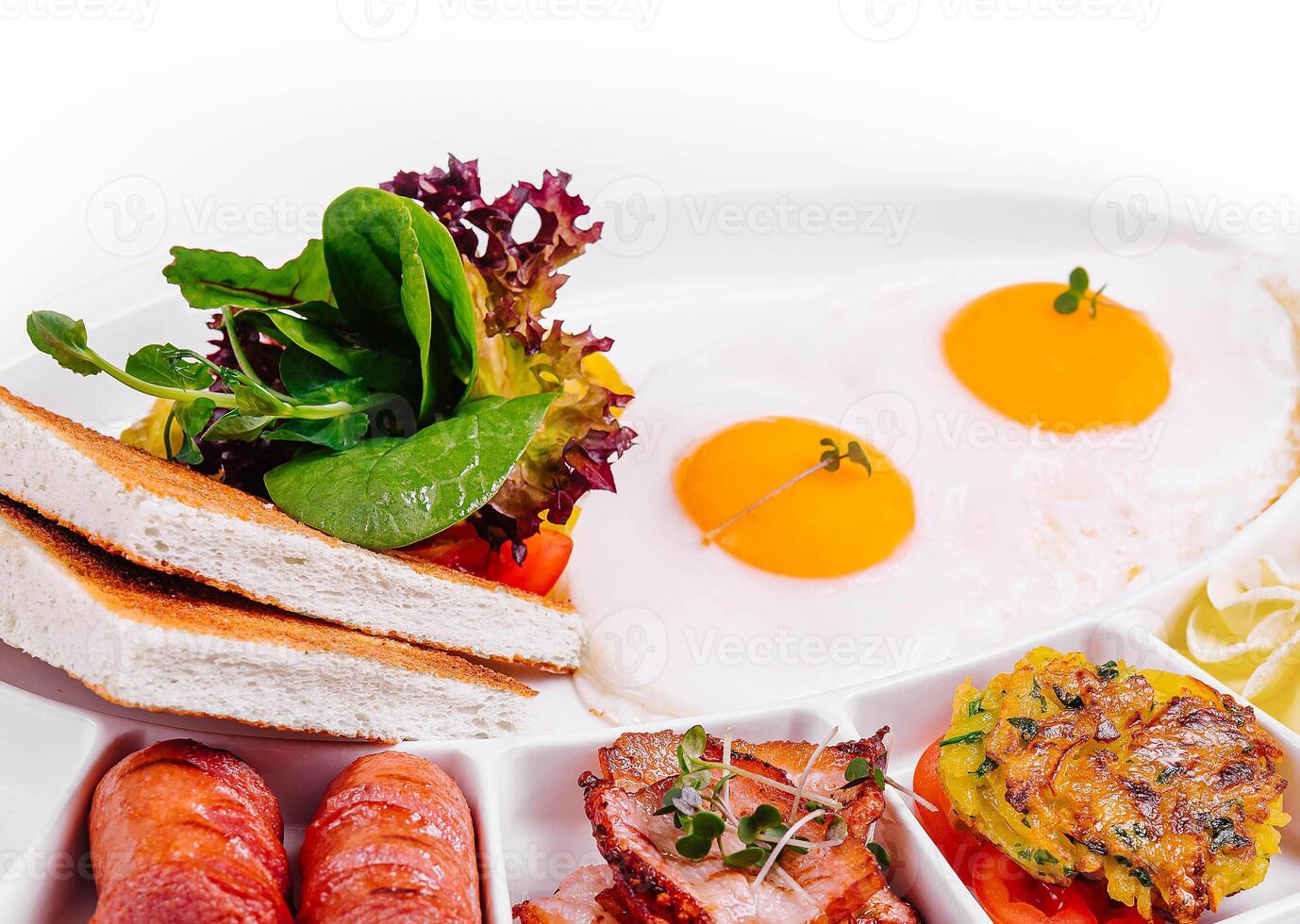 English Breakfast with Sausages, Bacon, and Toast photo