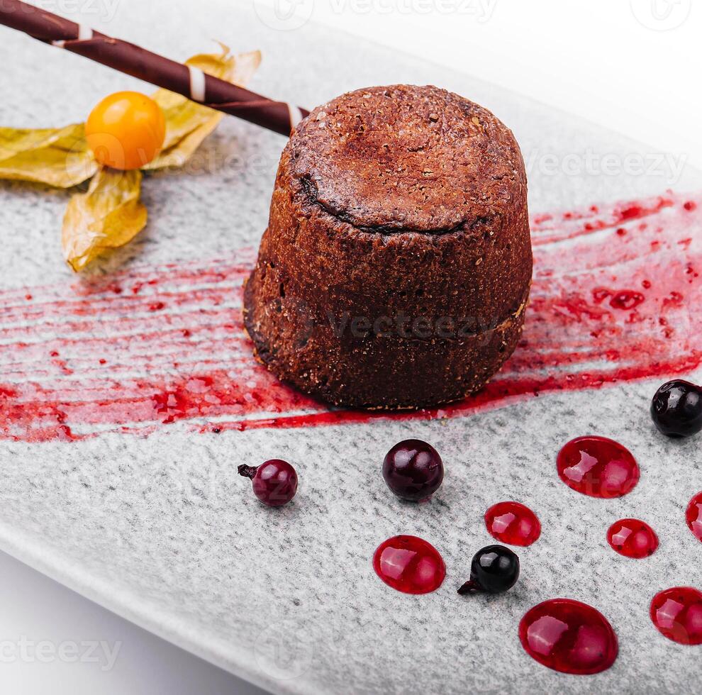 White plate with chocolate fondant cake photo