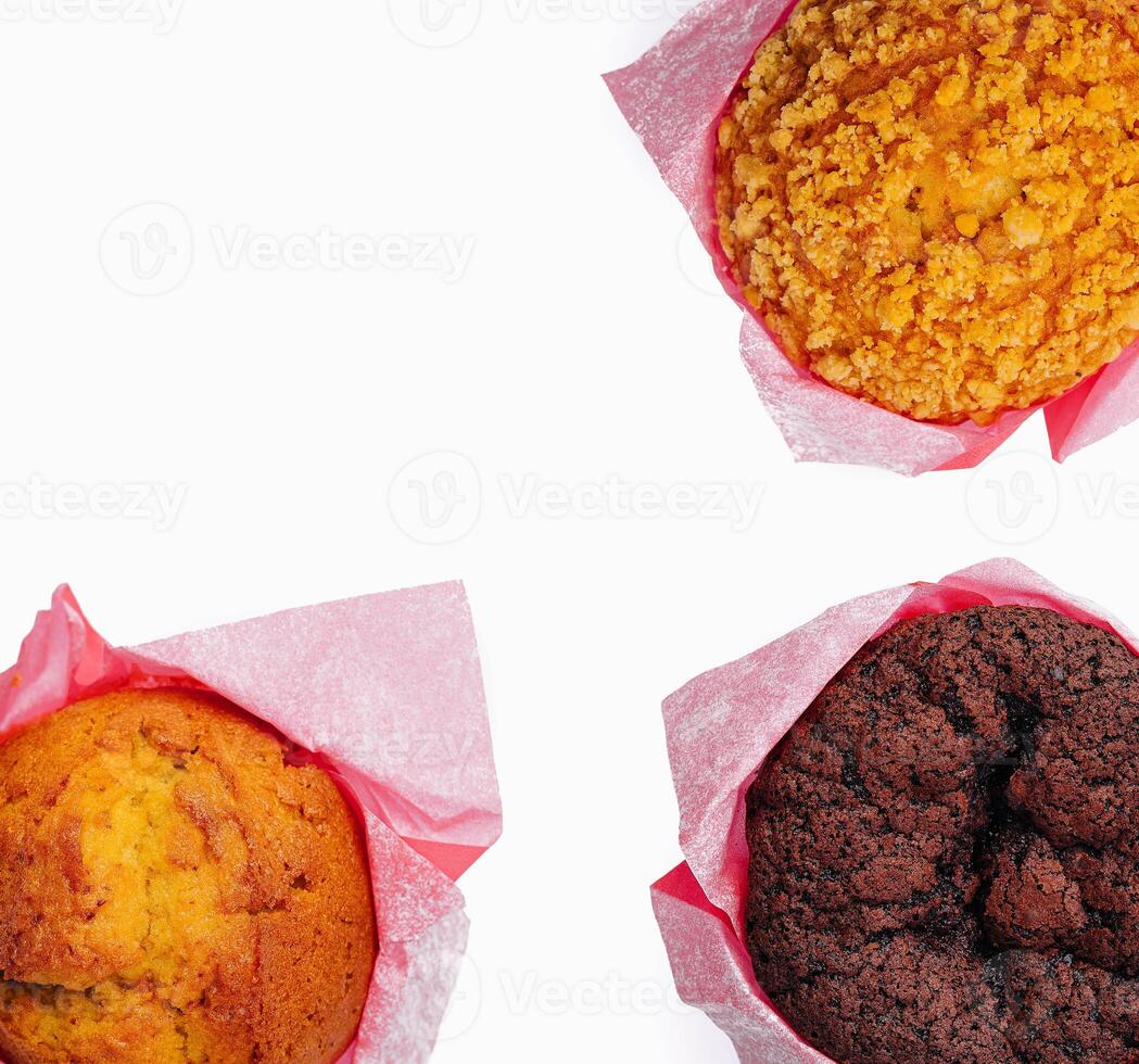 three different cupcakes on top view isolated photo
