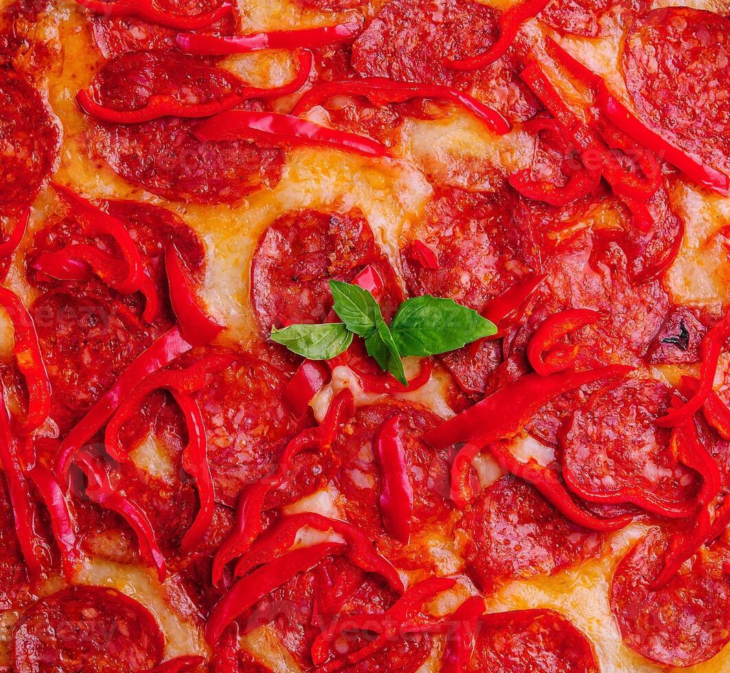 tasty pepperoni pizza with red bell peper close up photo