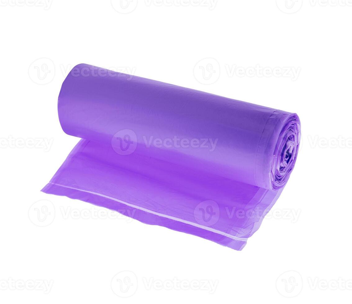 Purple roll of garbage bags isolated on white background photo