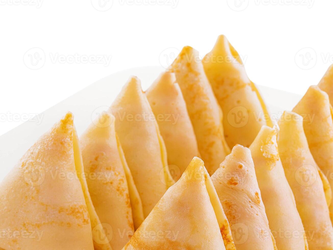 triangular pancakes with meat on plate photo