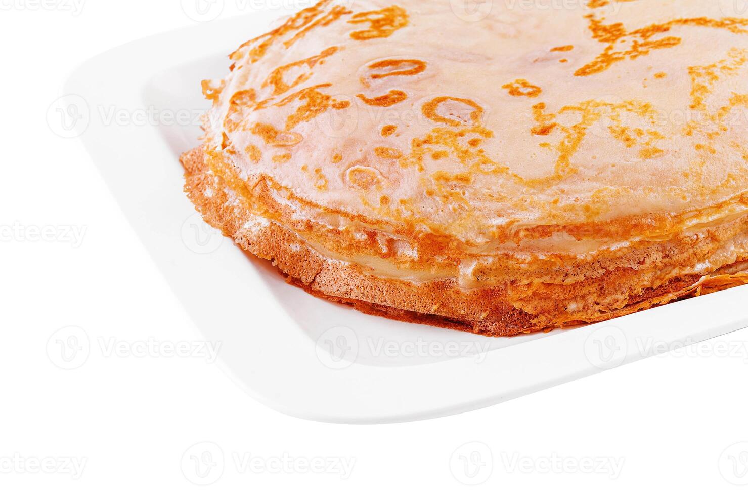 Tasty thin pancake on white plate photo