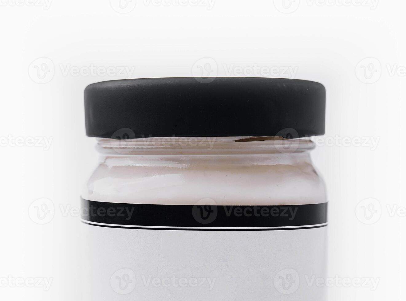 Mayonnaise in Glass Jar isolated on white photo