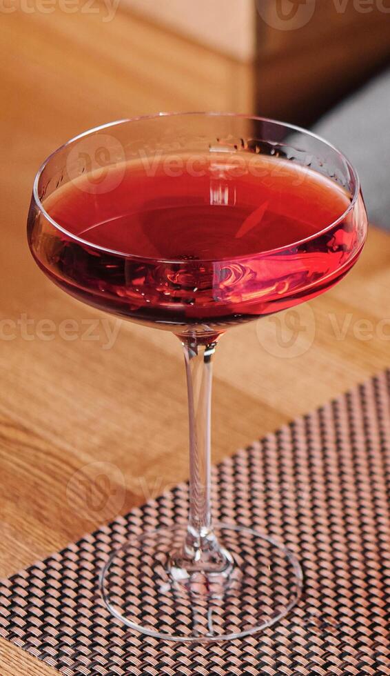 Red Cocktail in a martini glass photo